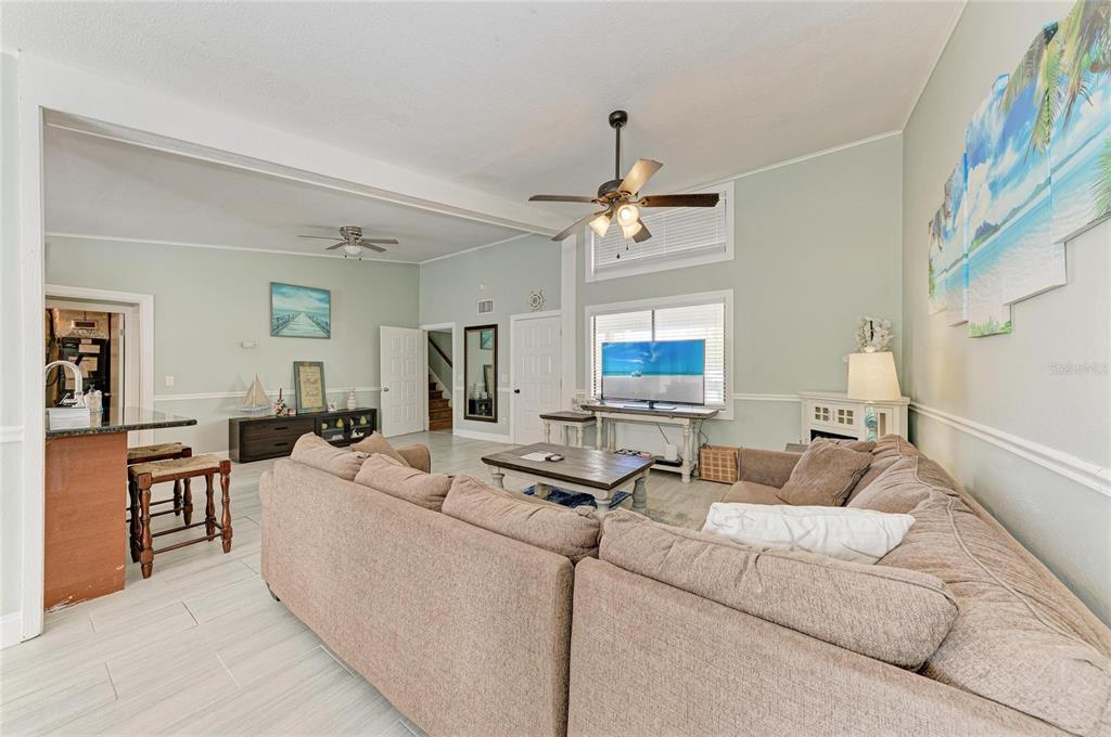 1581 Royal Road Venice, FL 34293 - Photo 11 of 41 a living room with furniture and a chandelier