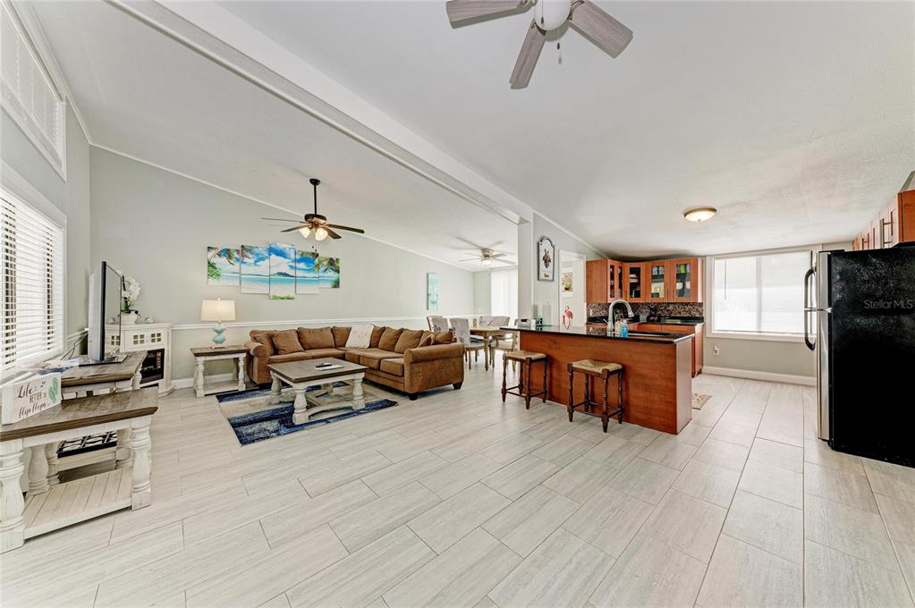 1581 Royal Road Venice, FL 34293 - Photo 12 of 41 a living room with furniture and a flat screen tv