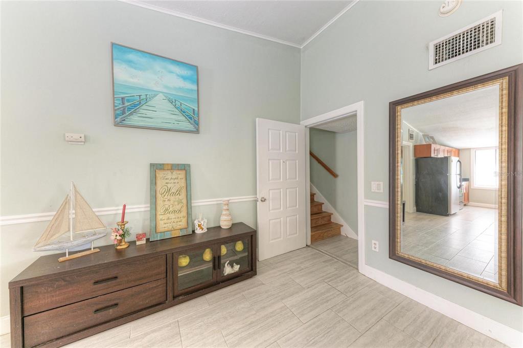 1581 Royal Road Venice, FL 34293 - Photo 21 of 41 a room with a dresser and a mirror