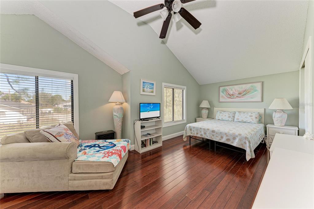 1581 Royal Road Venice, FL 34293 - Photo 22 of 41 a bedroom with a bed and wooden floor