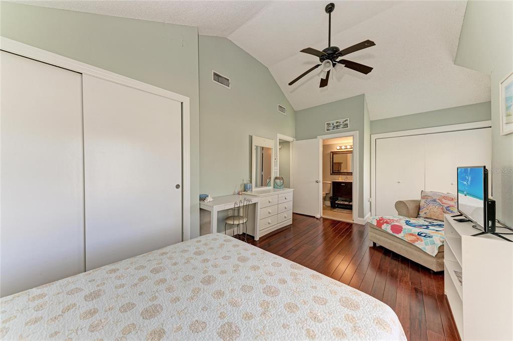 1581 Royal Road Venice, FL 34293 - Photo 24 of 41 a bedroom with a bed and a chandelier