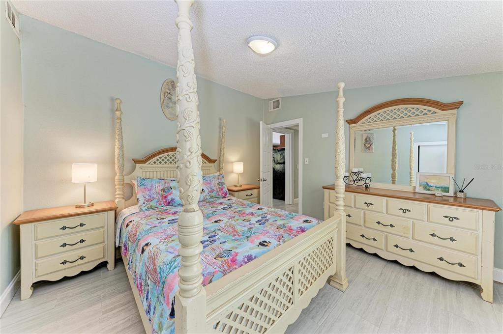 1581 Royal Road Venice, FL 34293 - Photo 30 of 41 a bedroom with a bed and a dresser