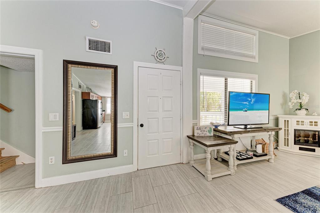 1581 Royal Road Venice, FL 34293 - Photo 7 of 41 a living room with furniture a rug and a window