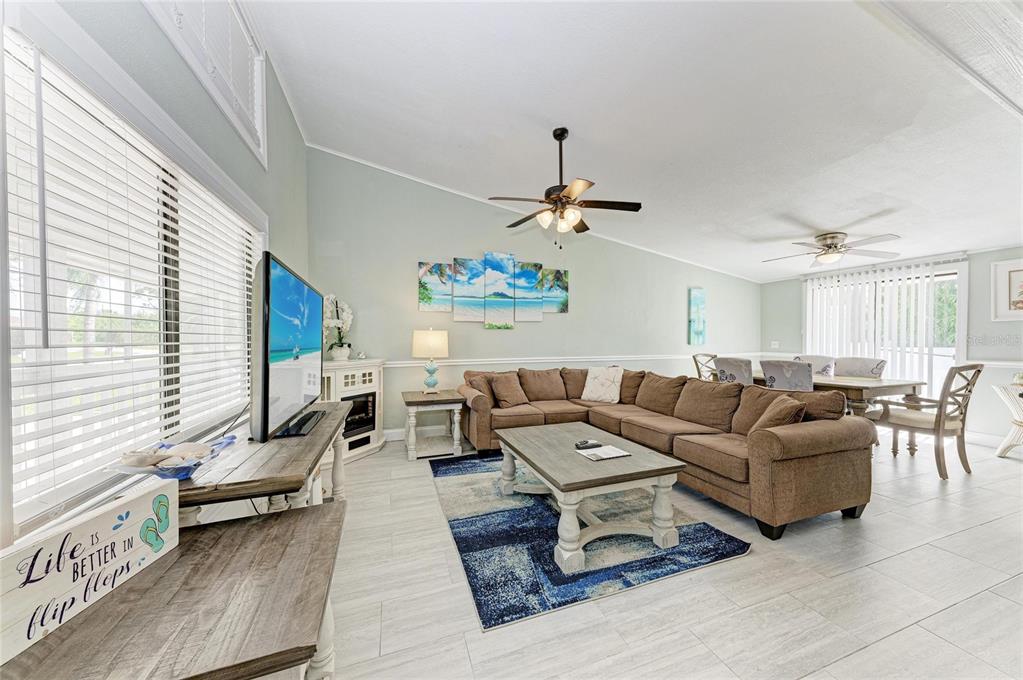1581 Royal Road Venice, FL 34293 - Photo 8 of 41 a living room with furniture and a large window