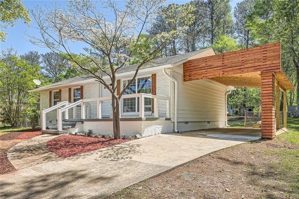 4201 Regal Ridge Road Austell, GA 30106 - Photo 1 of 21 a front view of a house with a yard and garage