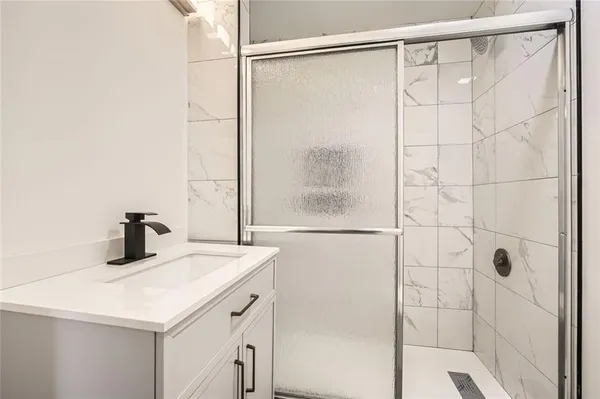 a bathroom with a sink and a shower