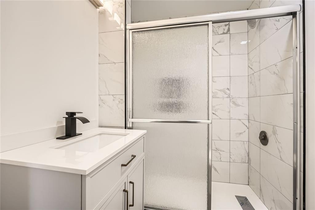 4201 Regal Ridge Road Austell, GA 30106 - Photo 10 of 21 a bathroom with a sink and a shower