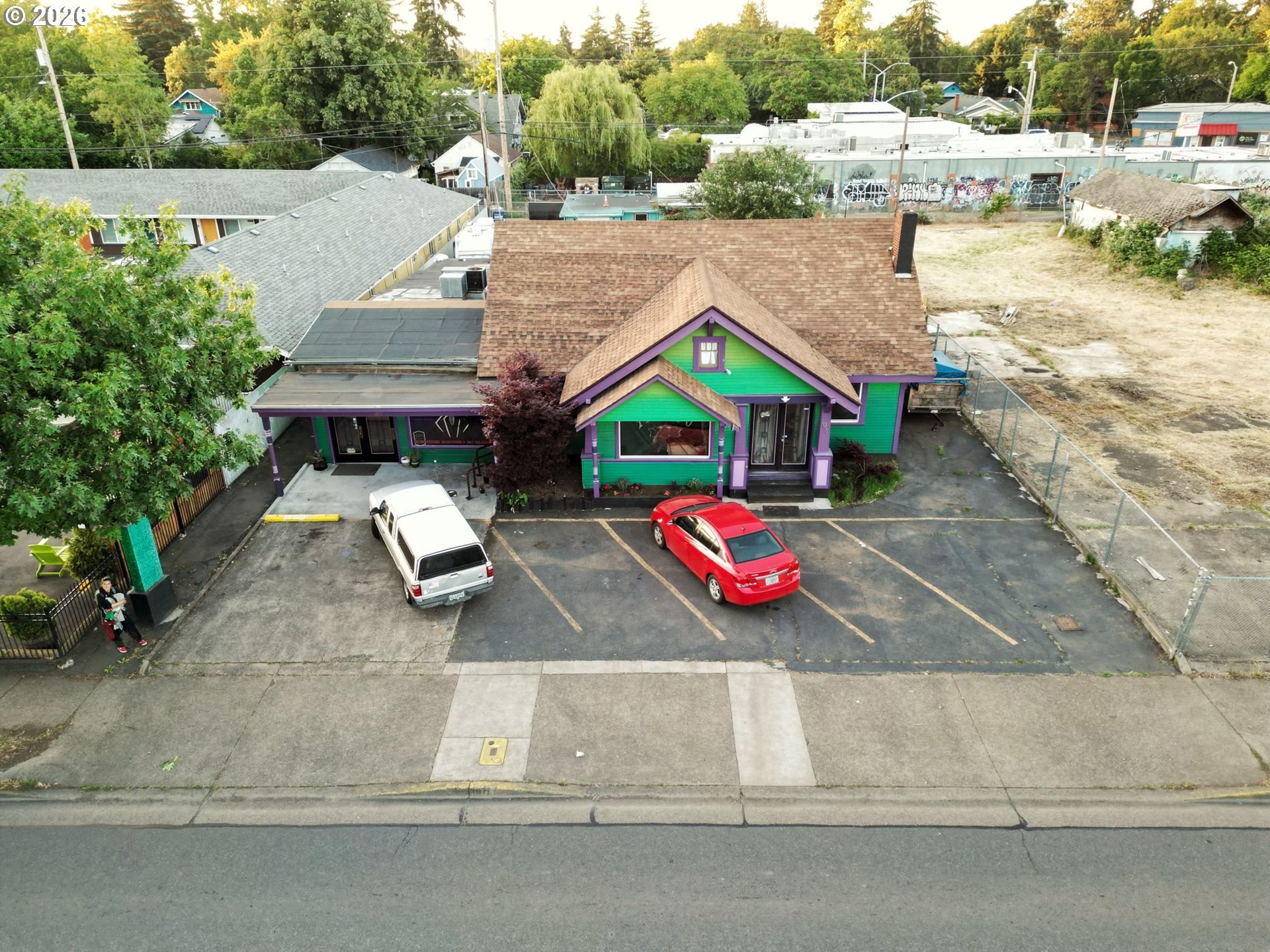 1030 West 5th Avenue Eugene, OR 97402 - Photo 3 of 10 an aerial view of a house with a yard and lake view