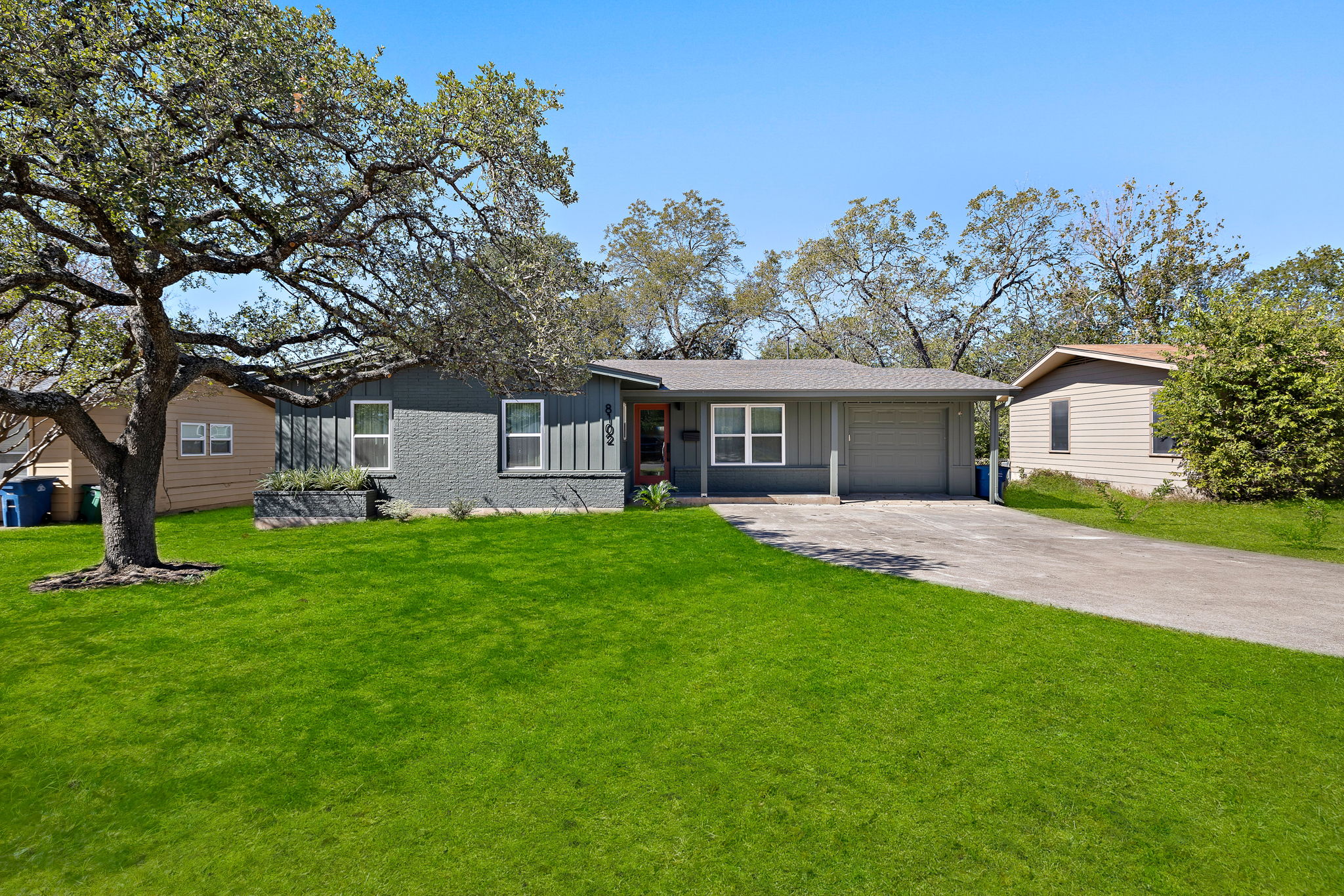 8102 Burrell Drive Austin, TX 78757 - Photo 2 of 35 front view of a house with a garden