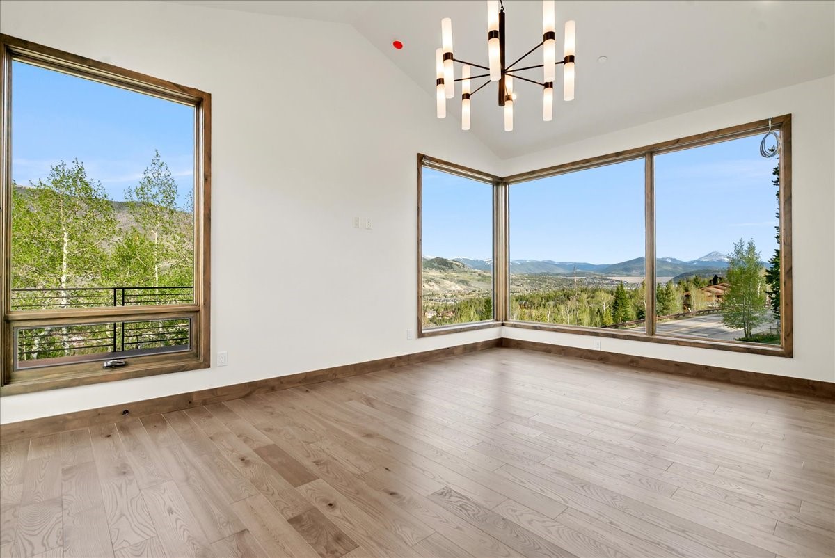 1615 Golden Eagle Road Silverthorne, CO 80498 - Photo 29 of 47 a view of an empty room with a window and wooden floor