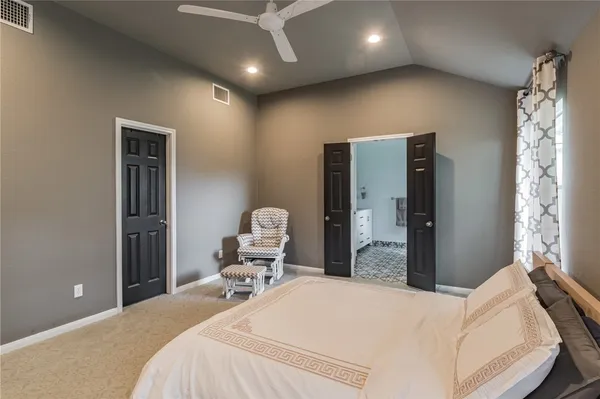 a bedroom with a bed and dresser