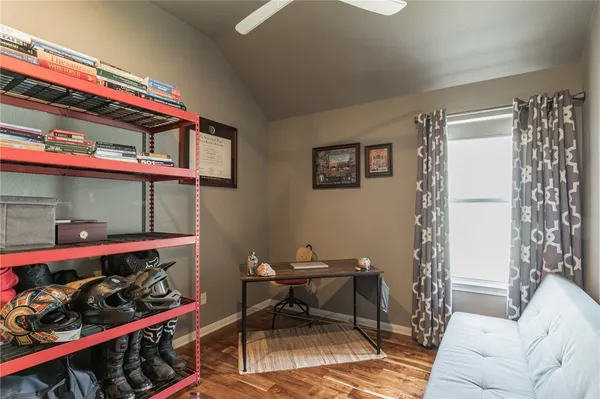 a living room with lots of furniture and a wooden floor