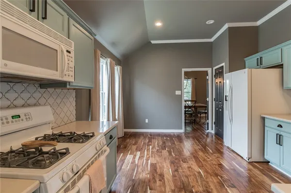 a kitchen with a refrigerator stove and a sink