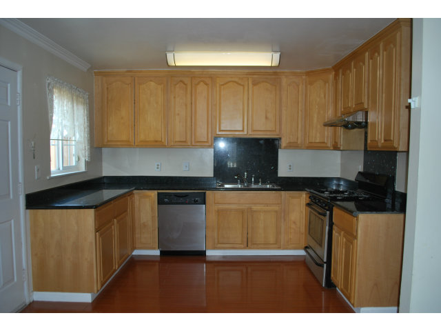 3167 Manda Drive San Jose, CA 95124 - Photo 2 of 6 a kitchen with stainless steel appliances granite countertop a stove a sink and a refrigerator
