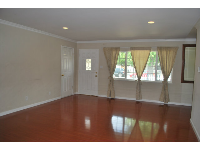 3167 Manda Drive San Jose, CA 95124 - Photo 3 of 6 a view of an empty room with wooden floor and a window