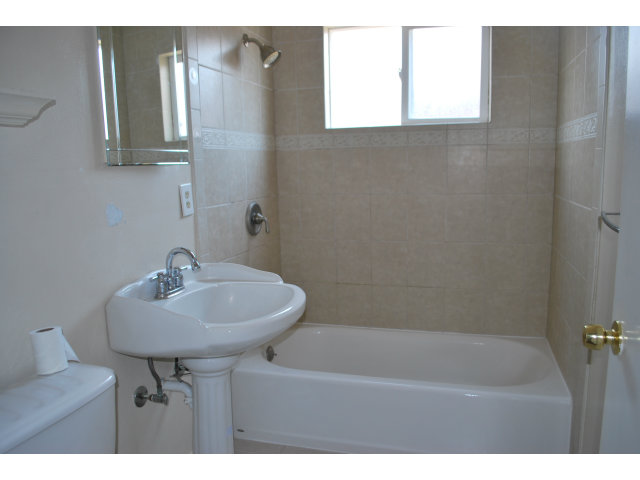 3167 Manda Drive San Jose, CA 95124 - Photo 4 of 6 a bathroom with a sink a mirror and a bathtub