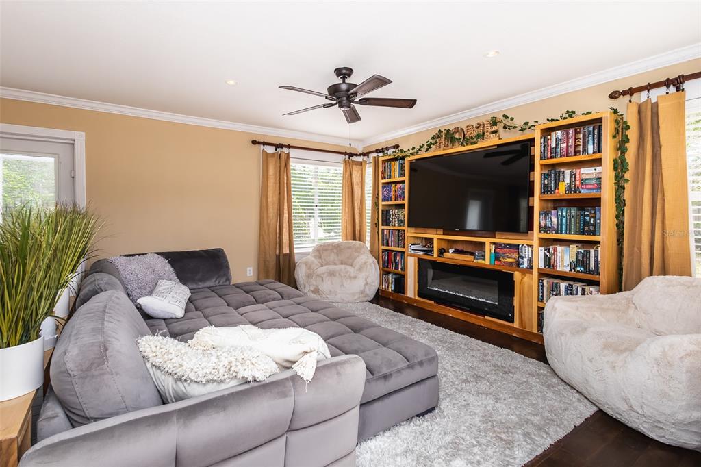 1001 Nottingham Street Orlando, FL 32803 - Photo 5 of 49 a living room with furniture and a flat screen tv