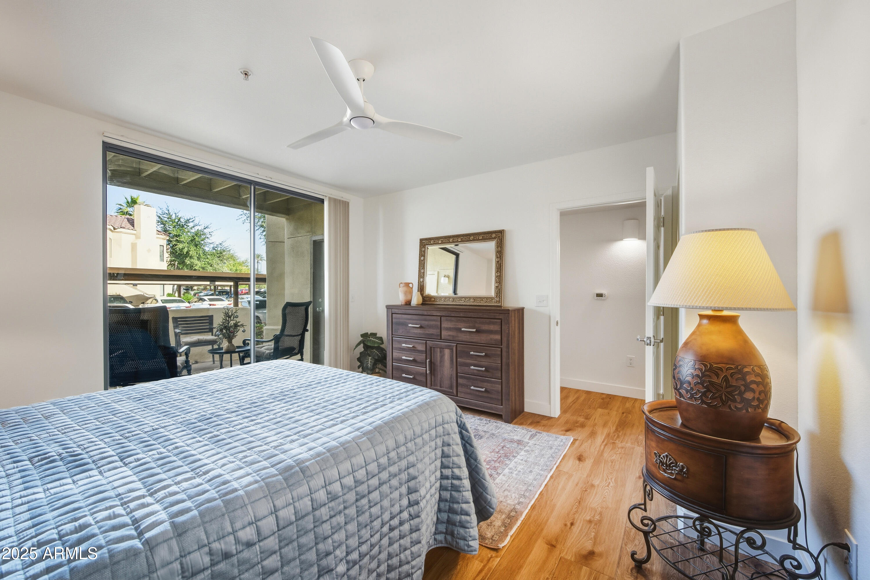 7575 East Indian Bend Road, Unit 1126 Scottsdale, AZ 85250 - Photo 12 of 33 a bed room with a bed and a television