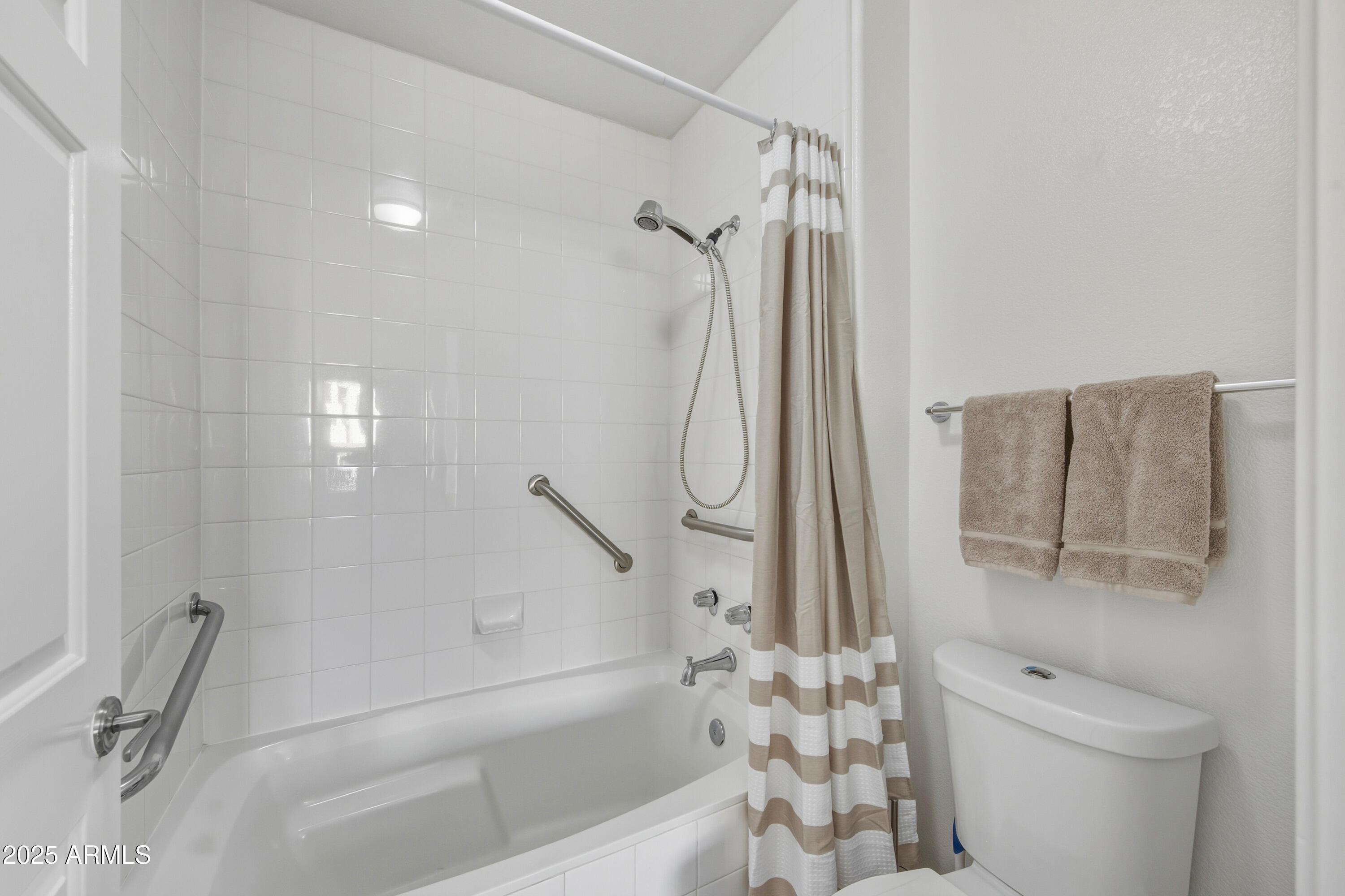 7575 East Indian Bend Road, Unit 1126 Scottsdale, AZ 85250 - Photo 15 of 33 a bathroom with a shower a toilet and a shower