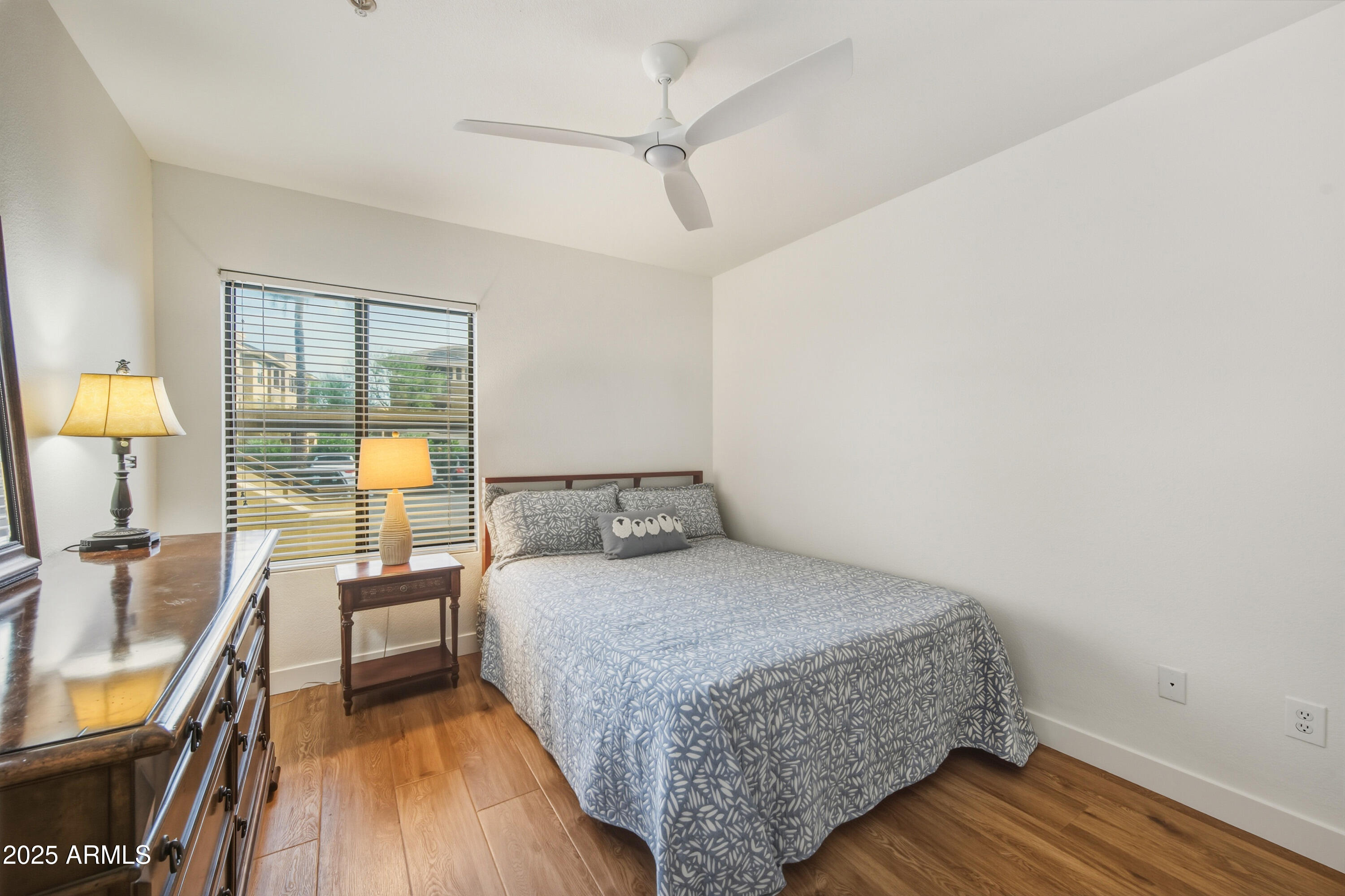 7575 East Indian Bend Road, Unit 1126 Scottsdale, AZ 85250 - Photo 18 of 33 a bedroom with a bed and a flat screen tv