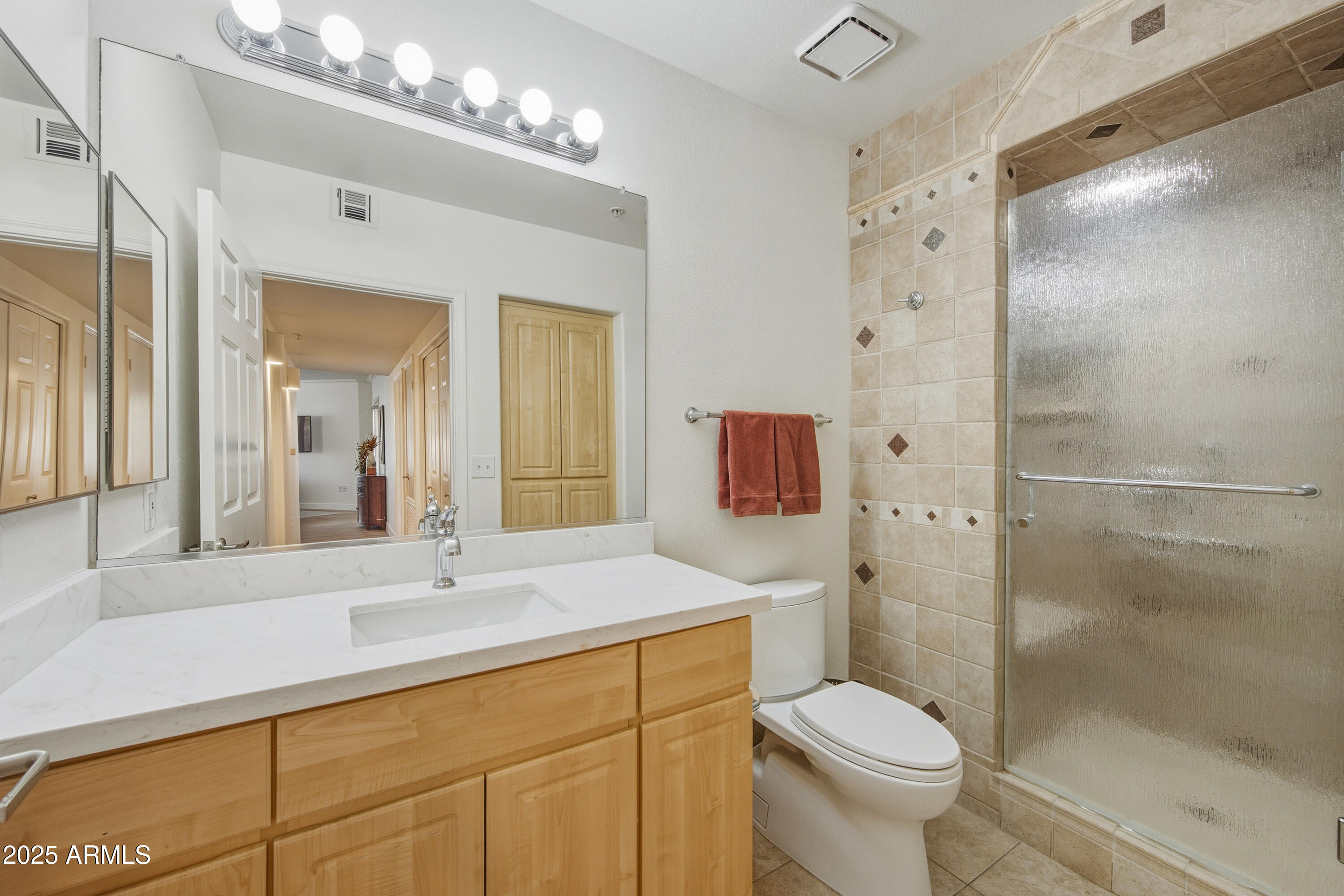 7575 East Indian Bend Road, Unit 1126 Scottsdale, AZ 85250 - Photo 20 of 33 a bathroom with a sink toilet vanity and shower