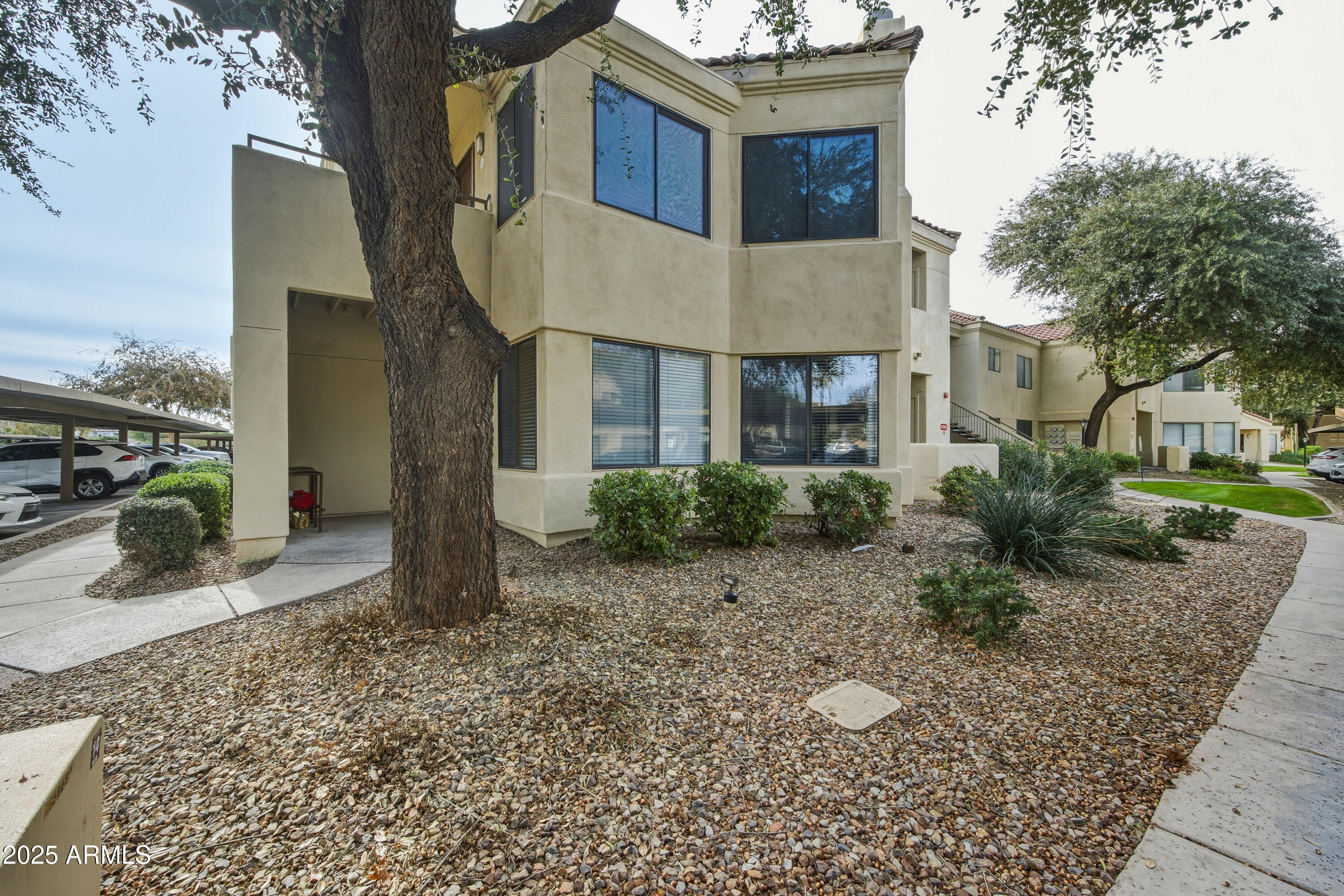 7575 East Indian Bend Road, Unit 1126 Scottsdale, AZ 85250 - Photo 2 of 33 a house view with a outdoor space
