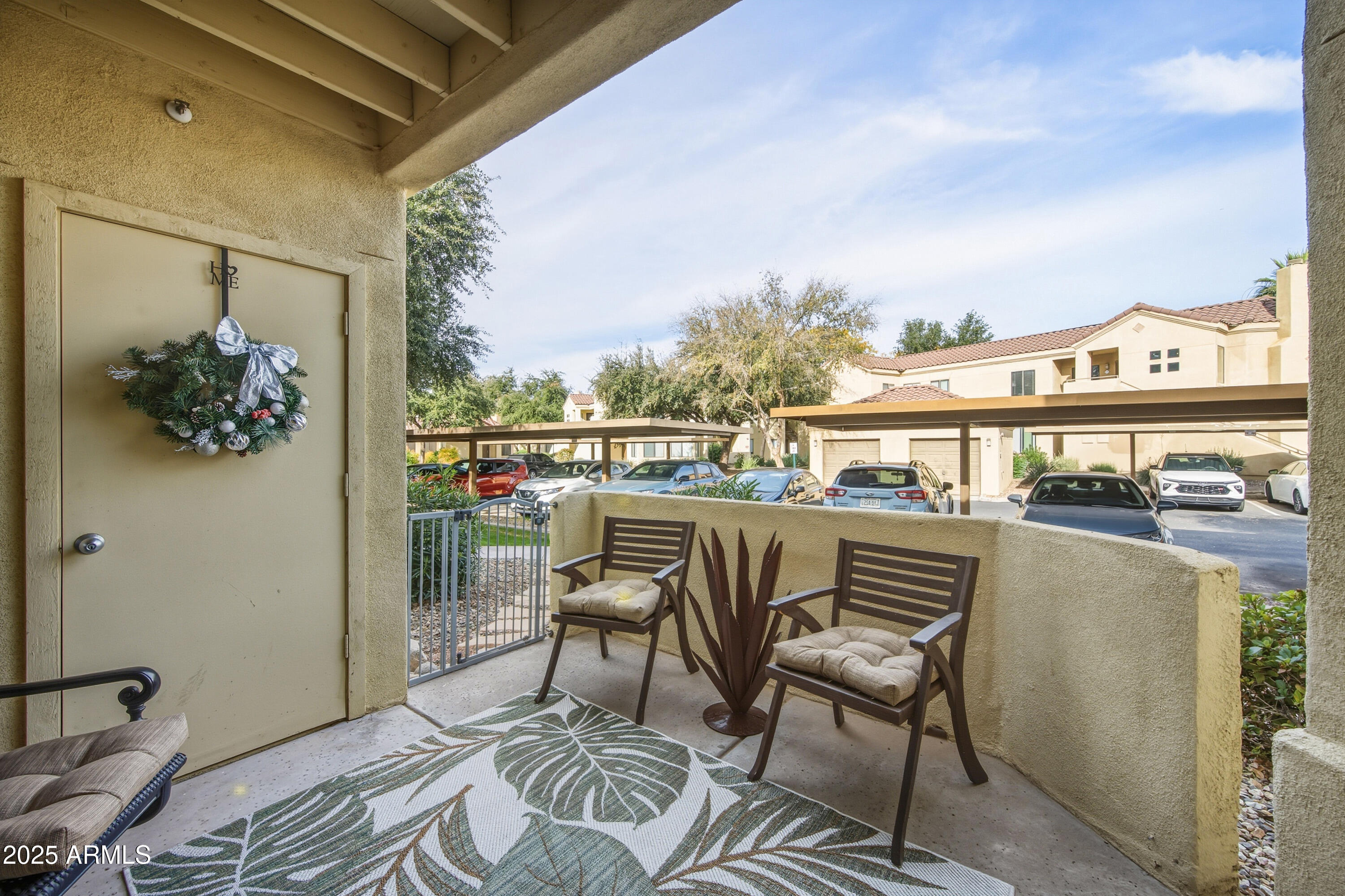 7575 East Indian Bend Road, Unit 1126 Scottsdale, AZ 85250 - Photo 22 of 33 a view of a chairs and table on the terrace