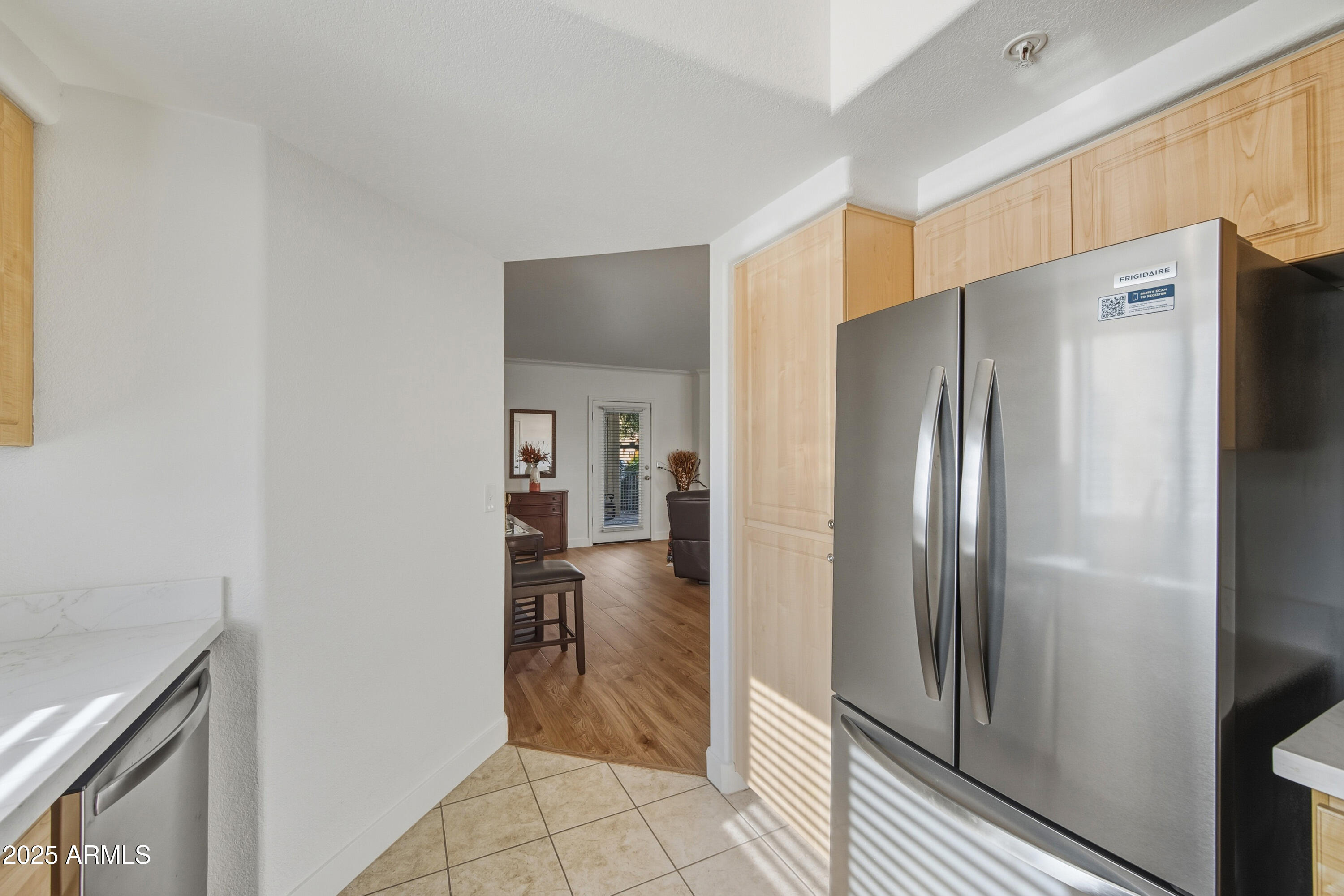 7575 East Indian Bend Road, Unit 1126 Scottsdale, AZ 85250 - Photo 8 of 33 a kitchen with a refrigerator and countertop