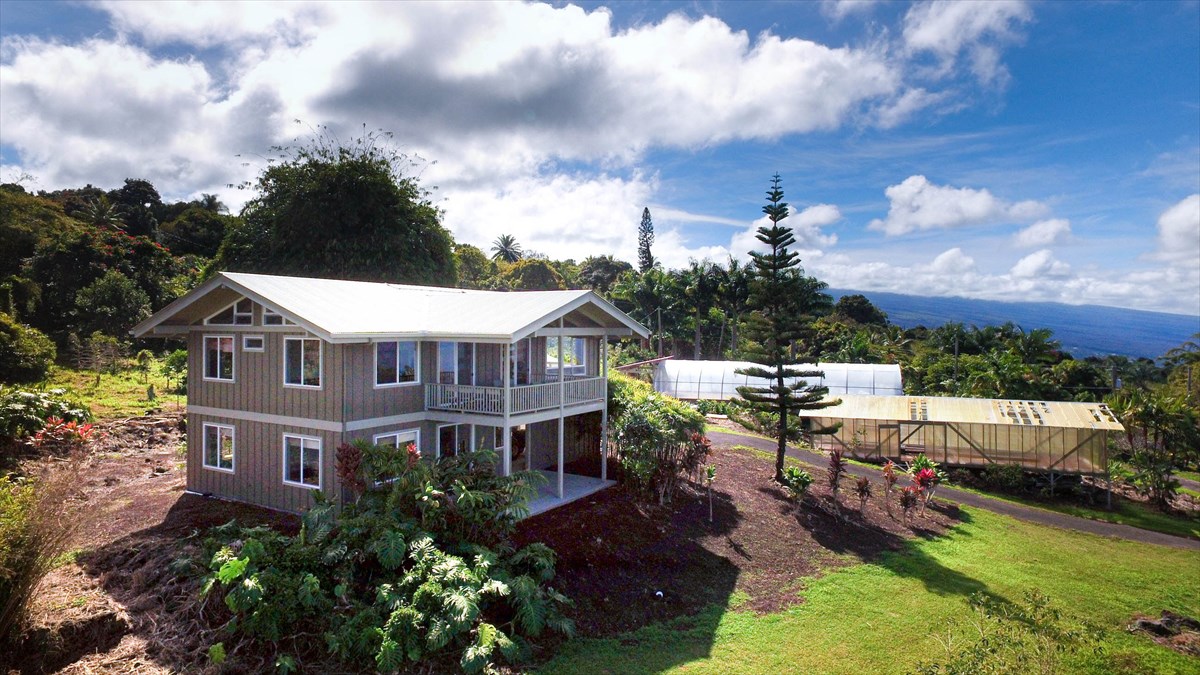 82-1135 Kinue Road Captain Cook, HI 96704 - Photo 1 of 30 a view of a house with garden and a sitting area