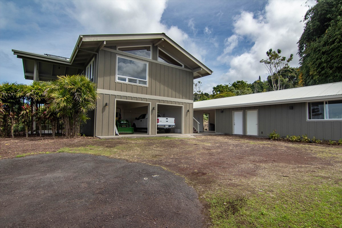 82-1135 Kinue Road Captain Cook, HI 96704 - Photo 13 of 30 a front view of a house with a yard and garage