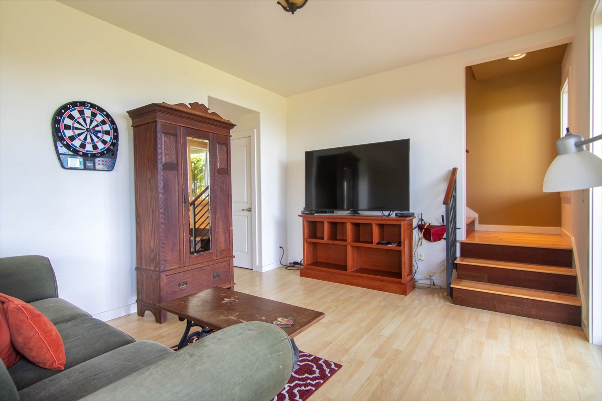 82-1135 Kinue Road Captain Cook, HI 96704 - Photo 17 of 30 a living room with furniture and a flat screen tv