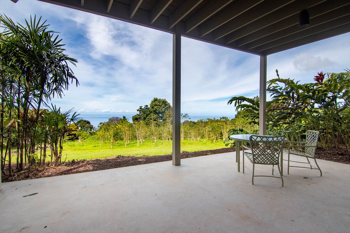 82-1135 Kinue Road Captain Cook, HI 96704 - Photo 27 of 30 a view of a porch with furniture and a yard
