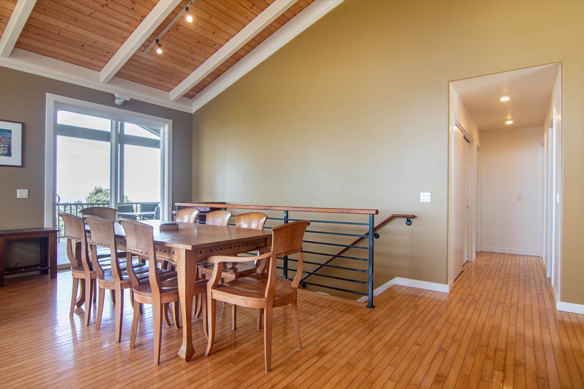 82-1135 Kinue Road Captain Cook, HI 96704 - Photo 7 of 30 a view of a dining room with furniture and wooden floor