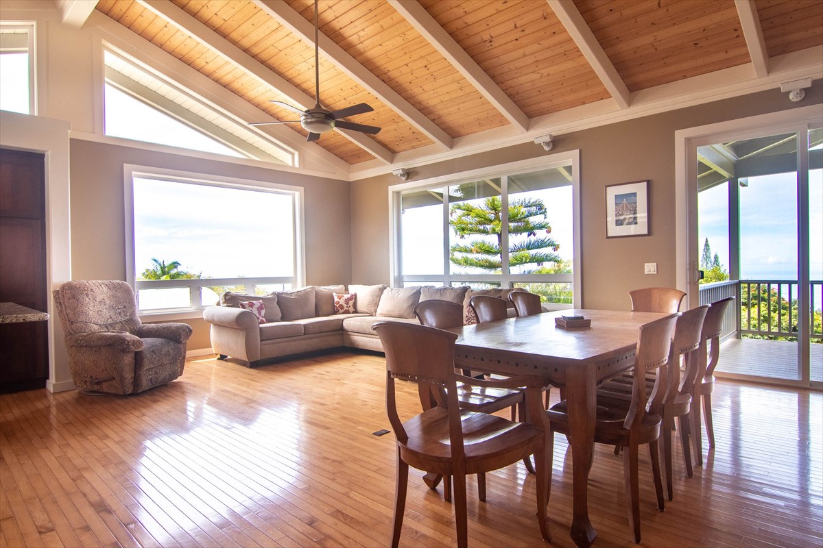 82-1135 Kinue Road Captain Cook, HI 96704 - Photo 8 of 30 a view of a dining room with furniture window and wooden floor