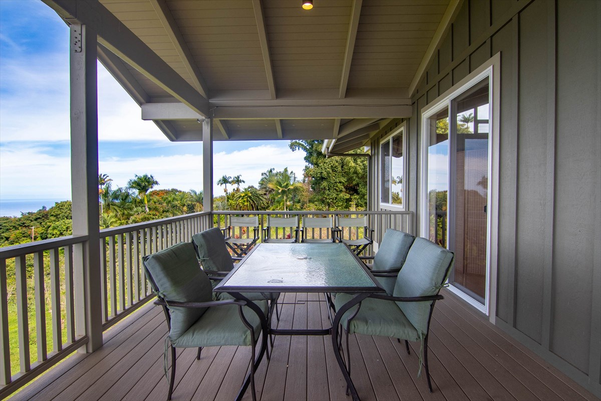 82-1135 Kinue Road Captain Cook, HI 96704 - Photo 9 of 30 a view of balcony with furniture and wooden floor