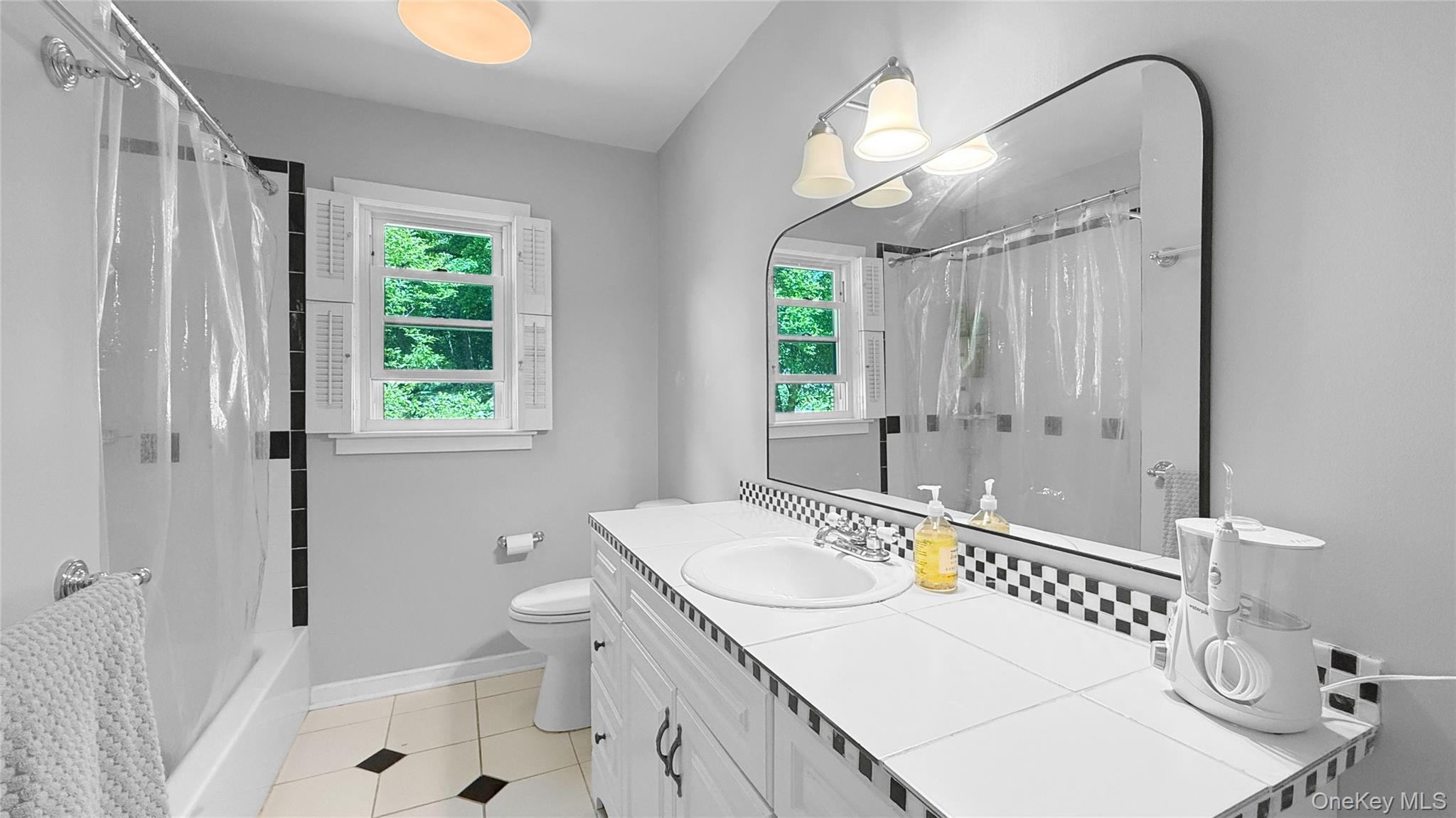 15 Whitehill Place Cold Spring, NY 10516 - Photo 9 of 12 a bathroom with a sink a toilet and a mirror