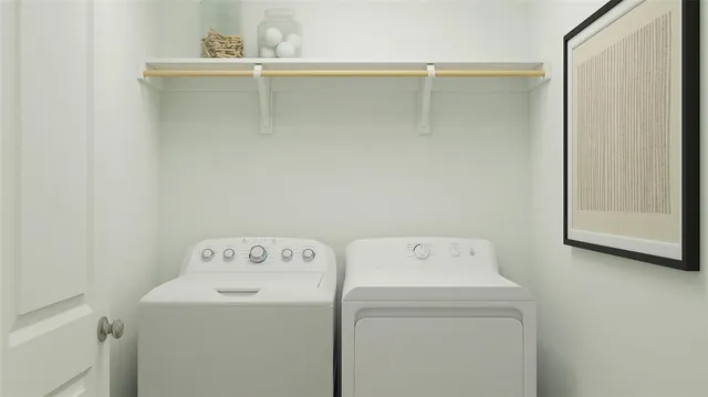 a utility room with dryer and washer