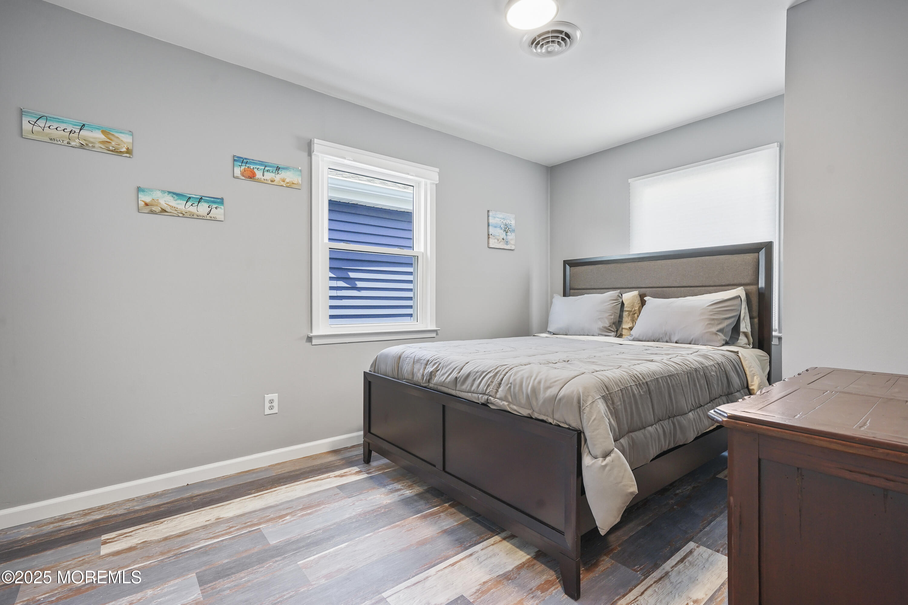 214 Webster Avenue, Unit 2 Seaside Heights, NJ 08751 - Photo 12 of 14 a bedroom with a bed and a window