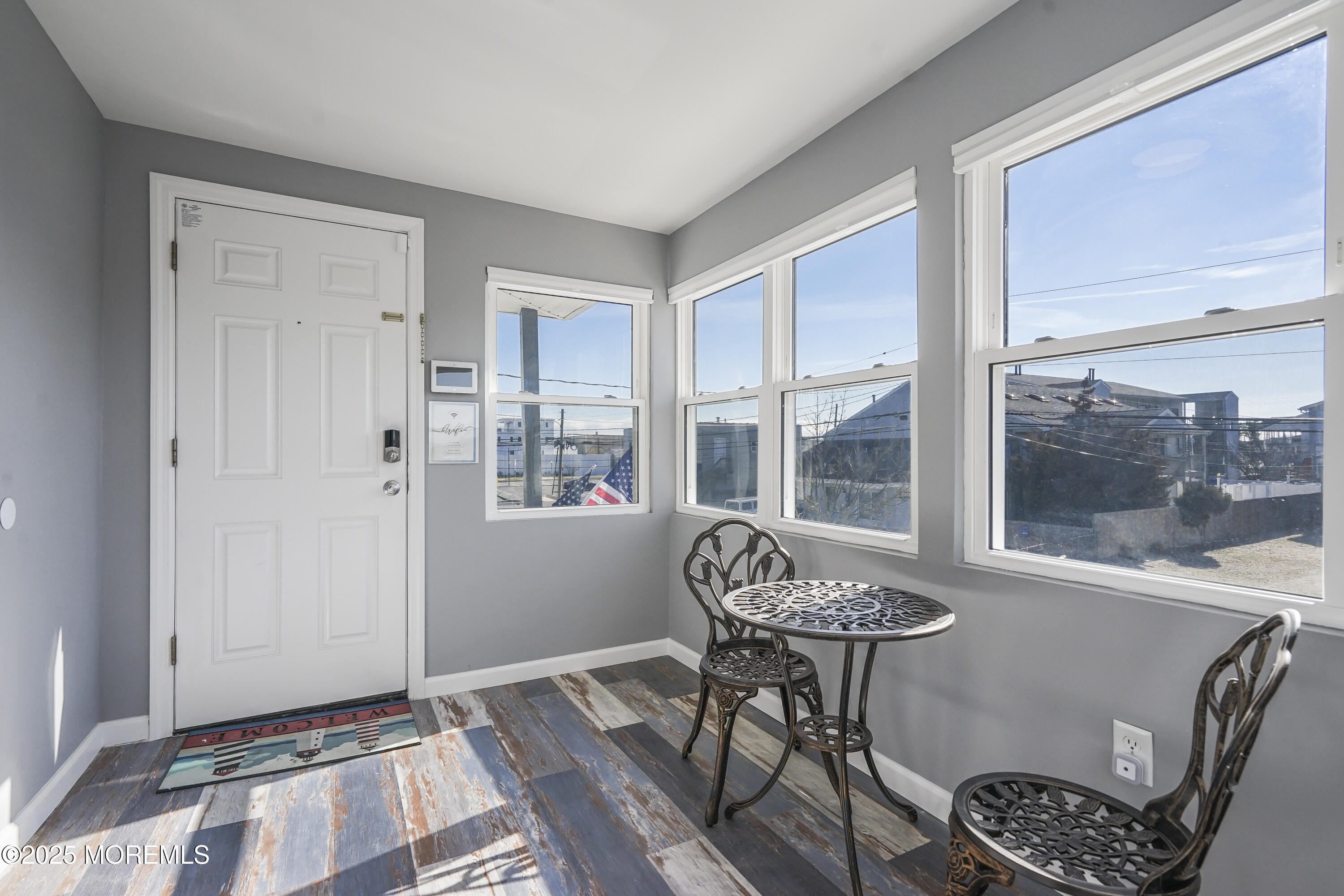 214 Webster Avenue, Unit 2 Seaside Heights, NJ 08751 - Photo 13 of 14 a living room with furniture and a window