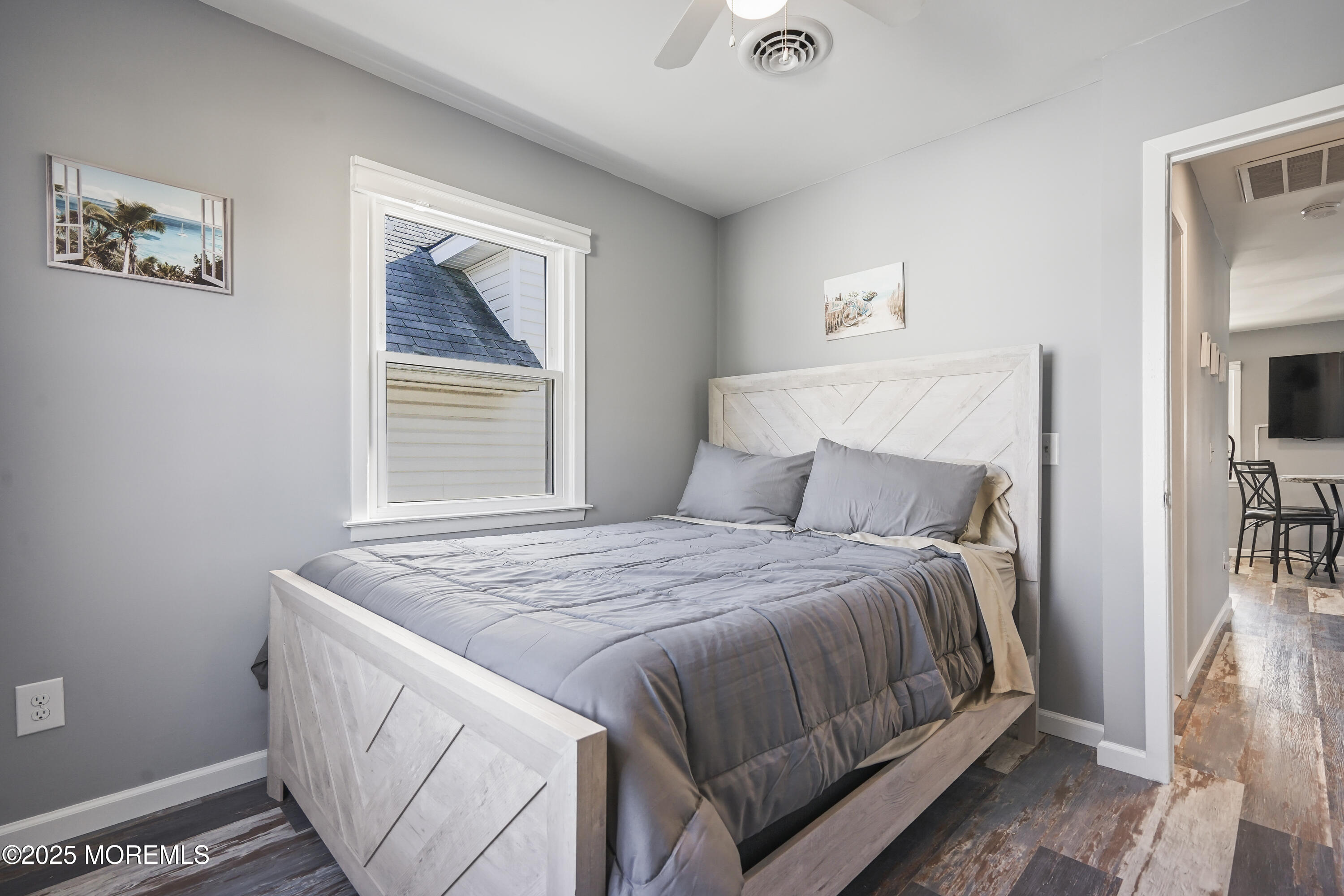 214 Webster Avenue, Unit 2 Seaside Heights, NJ 08751 - Photo 9 of 14 a bedroom with a bed and a window