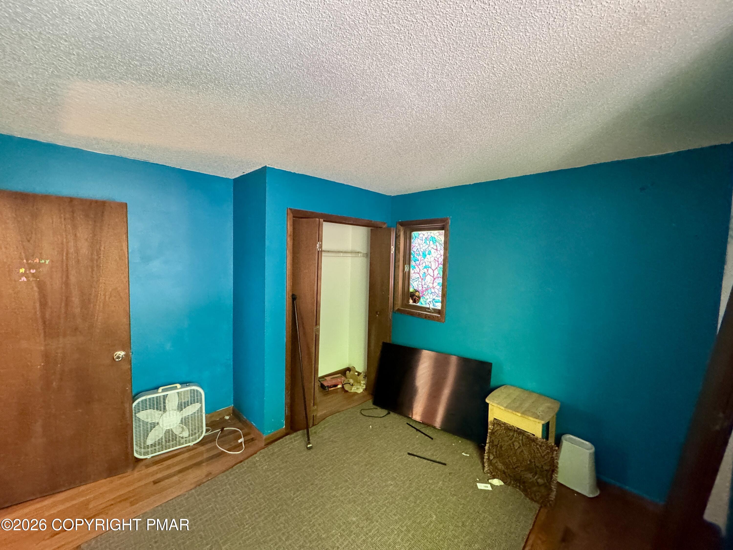 119 Durham Drive Bushkill, PA 18324 - Photo 7 of 41 a bedroom with a bed and a window