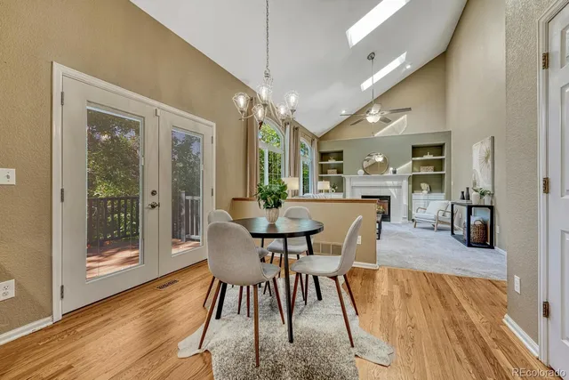 a dining room with furniture and wooden floor