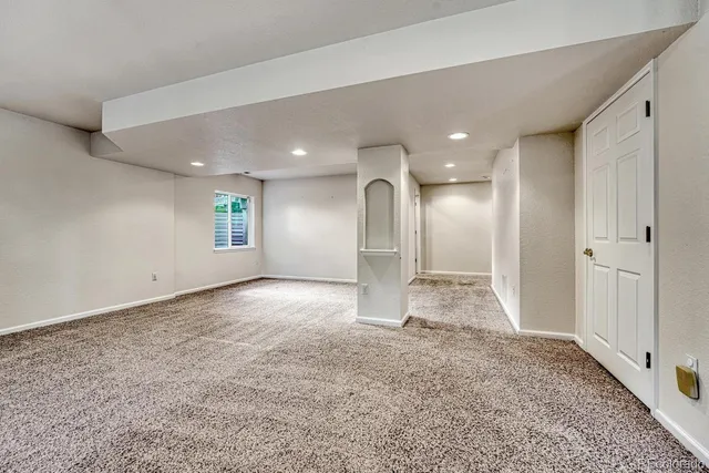 a view of a big room with windows and closet