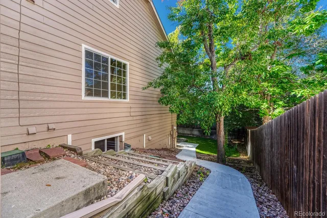 a view of backyard with a tub and trees