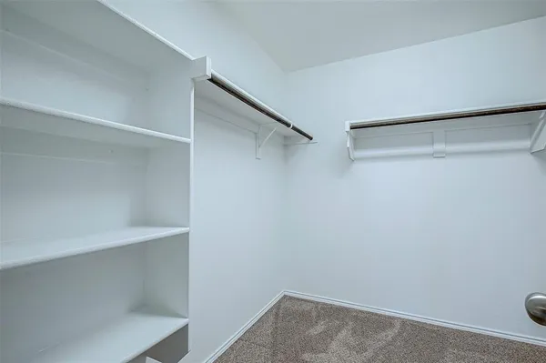 a view of an empty walk in closet