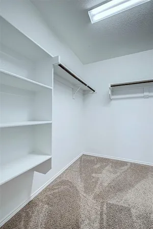 a view of a room with shelf on the wall