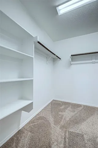 a view of a room with shelf on the wall