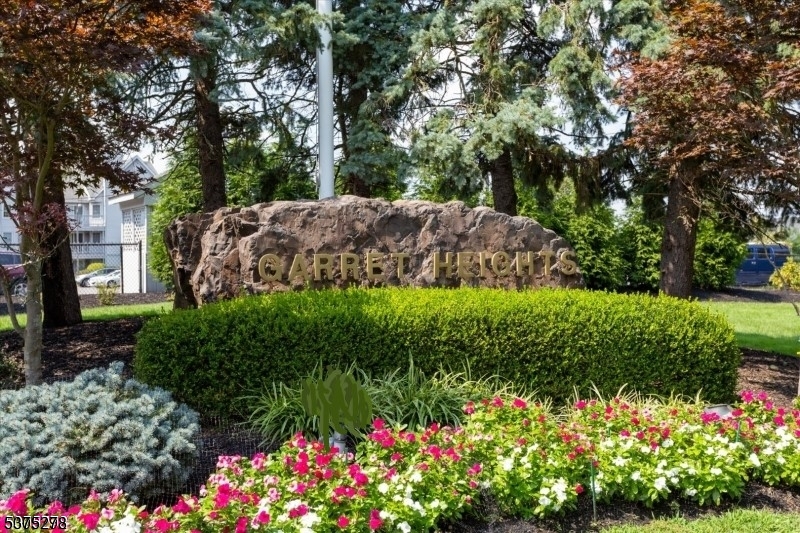 70 Boulder Run Road Paterson, NJ 07501 - Photo 2 of 29 a view of a garden with flowers and trees