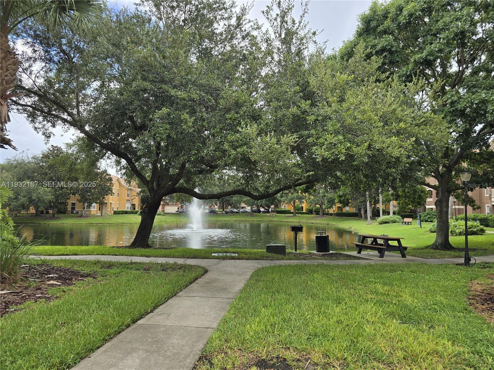 19914 Villa Creek Drive, Unit 202 Orlando, FL 32821 - Photo 13 of 19 a view of house with a yard