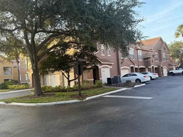 a view of a street with houses on the side